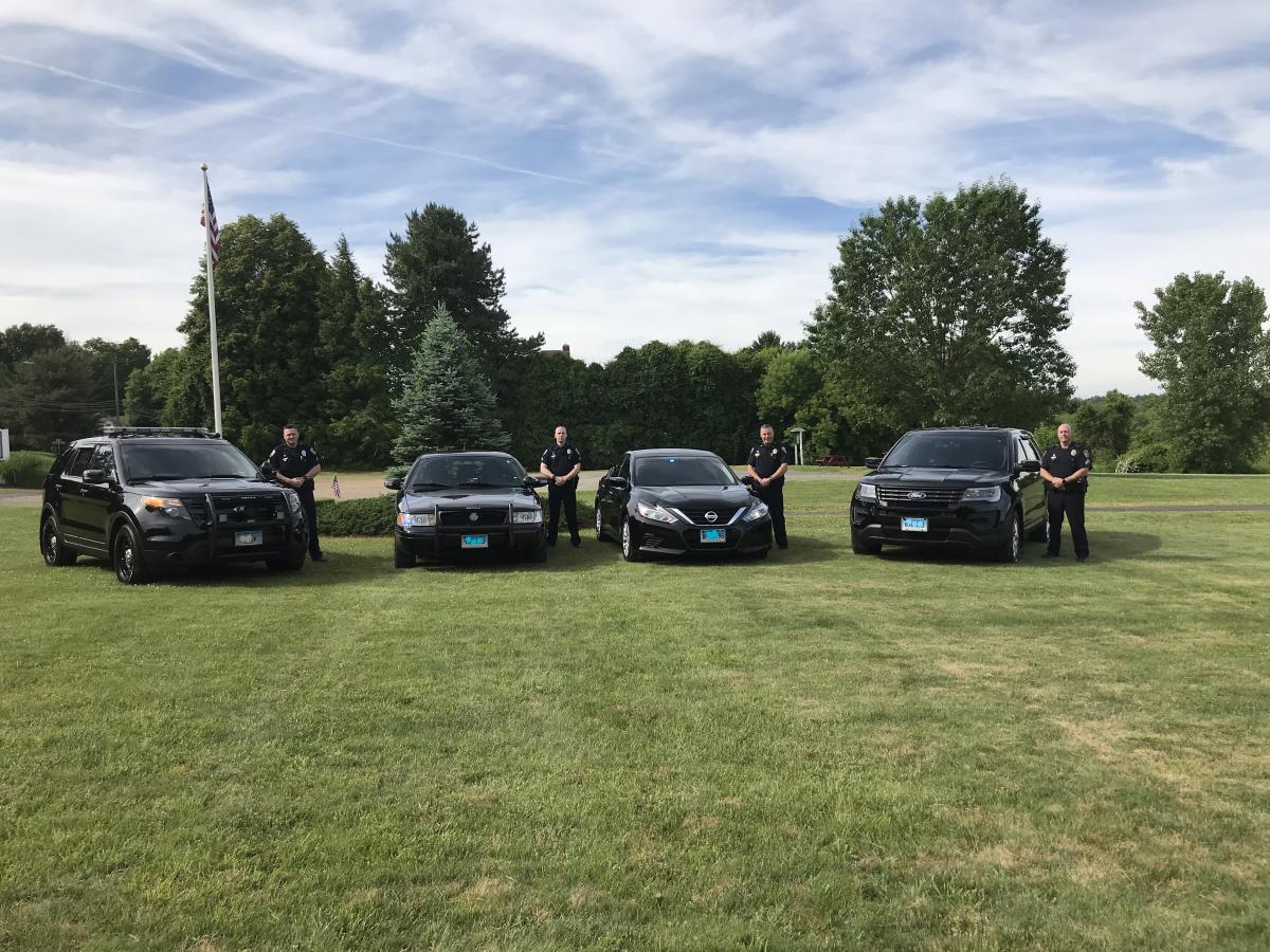 officers standing near their vehicles