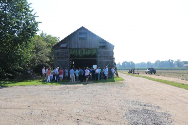 frontal of barn and people